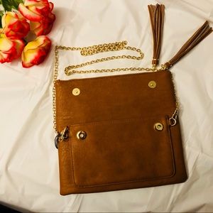 Cute clutch style bag with detachable chain.
